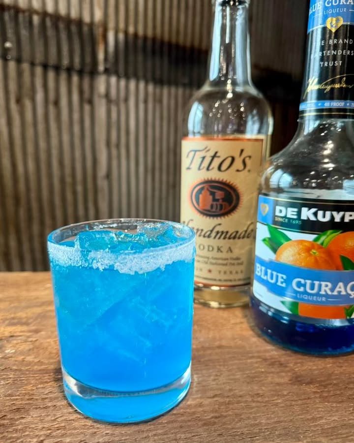 A refreshing Detroit Blue Lagoon cocktail served in a glass with vibrant colors.