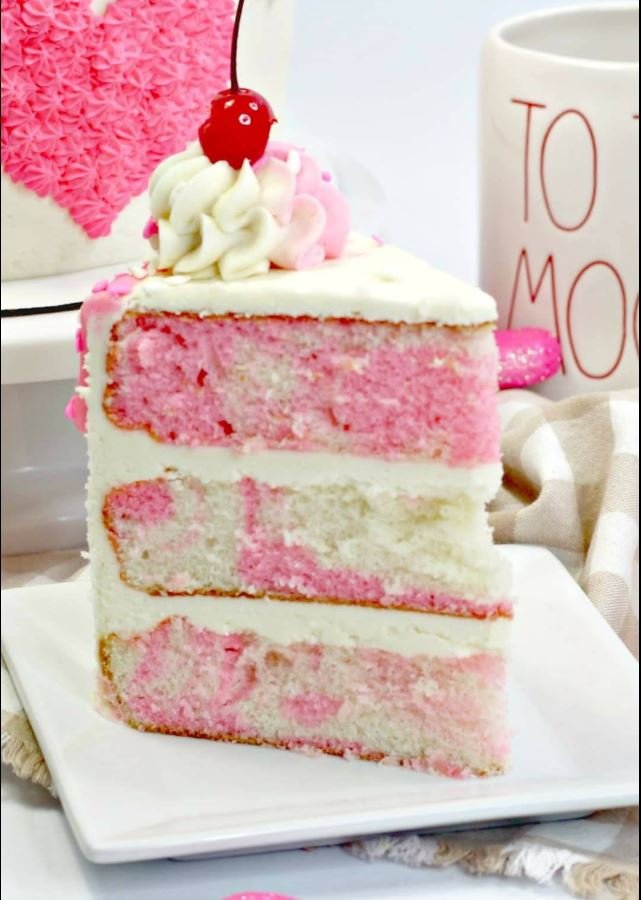 Delicious Romantic Vanilla Buttercream Cake decorated with pink frosting.